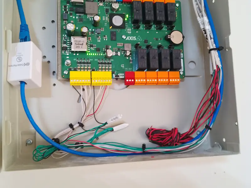Enclosure with a controller board and a small network device.